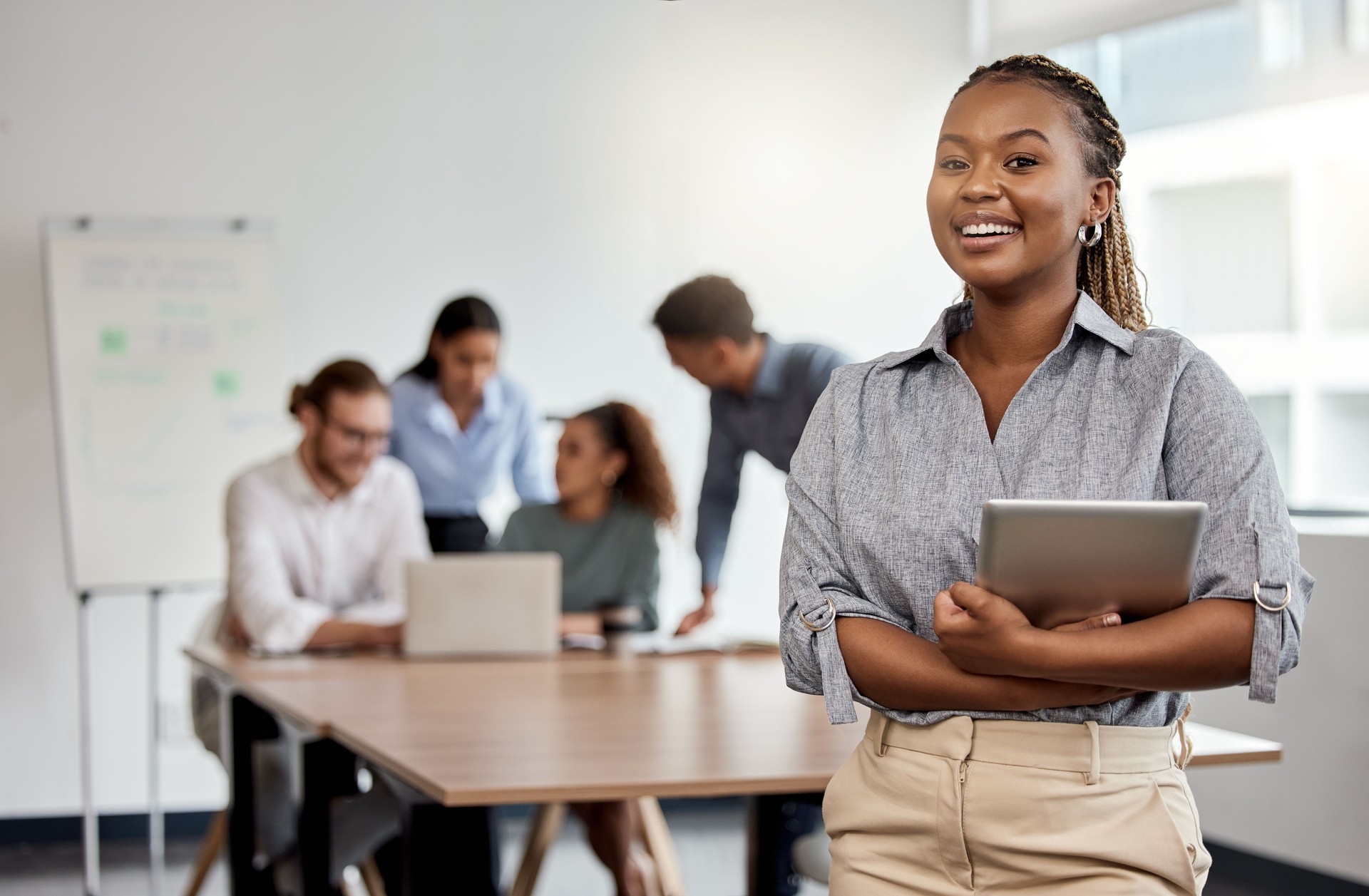 Shot of a businesswoman holding a digital tablet while standing in the boardroom